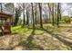 A large, private backyard features a spacious yard with mature trees and deck at 2755 Austin Ln, Jonesboro, GA 30236