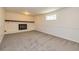 Spacious carpeted basement with a painted brick fireplace feature at 2755 Austin Ln, Jonesboro, GA 30236