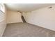 A finished basement with a neutral carpet, a fan and natural light at 2755 Austin Ln, Jonesboro, GA 30236