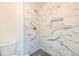 Updated bathroom features a sleek shower with black and white marble-style tile at 2755 Austin Ln, Jonesboro, GA 30236