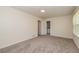 Spacious bedroom with plush gray carpet and natural light from the large window at 2755 Austin Ln, Jonesboro, GA 30236