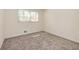 A well-lit bedroom provides a comfortable and versatile space, carpeted for warmth and relaxation at 2755 Austin Ln, Jonesboro, GA 30236