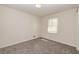 Cozy bedroom with neutral carpeting, a bright window, and ample space for relaxation at 2755 Austin Ln, Jonesboro, GA 30236