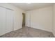 Neutral bedroom boasts soft gray carpet and closet with sliding doors at 2755 Austin Ln, Jonesboro, GA 30236