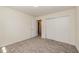 Neutral bedroom featuring soft carpet and closet space for storage at 2755 Austin Ln, Jonesboro, GA 30236