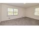 Bedroom with plush gray carpet and natural light streaming through windows at 2755 Austin Ln, Jonesboro, GA 30236