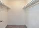 Walk-in closet featuring built-in shelving, and plush gray carpet at 2755 Austin Ln, Jonesboro, GA 30236