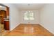 Bright dining room with gleaming hardwood floors and a modern chandelier, perfect for Gathering meals at 2755 Austin Ln, Jonesboro, GA 30236