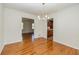 Traditional dining room featuring hardwood floors and a modern chandelier at 2755 Austin Ln, Jonesboro, GA 30236