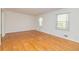 Inviting living room featuring gleaming hardwood floors and bright windows at 2755 Austin Ln, Jonesboro, GA 30236