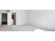 Bright, carpeted bedroom with an open door to an attached bathroom for added convenience at 2959 Rambler Dr, Loganville, GA 30052