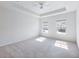 Bright and airy primary bedroom with plush carpet, ample natural light, and a calming neutral palette at 2959 Rambler Dr, Loganville, GA 30052