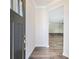 Inviting entryway featuring luxury vinyl plank flooring and neutral paint, leading to a bright, open living space at 2959 Rambler Dr, Loganville, GA 30052