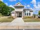 Inviting entryway with manicured lawn and lush plantings in front of this home at 2959 Rambler Dr, Loganville, GA 30052