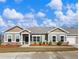 Charming single-story home with well-manicured landscaping, beautiful lawn and inviting curb appeal at 2959 Rambler Dr, Loganville, GA 30052