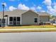 Exterior view of new construction townhomes featuring a screened-in porch at 2959 Rambler Dr, Loganville, GA 30052