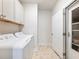 Well-lit laundry room with modern washer and dryer, offering convenience and functionality at 2959 Rambler Dr, Loganville, GA 30052