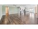 Open-concept living space featuring luxury vinyl plank flooring, neutral walls, and a view into the kitchen at 2959 Rambler Dr, Loganville, GA 30052