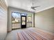 Screened in back porch featuring a ceiling fan and exterior view at 2959 Rambler Dr, Loganville, GA 30052