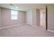 Carpeted basement bedroom with a window and a closet at 5170 2Nd St, Morrow, GA 30260
