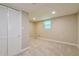 Basement bedroom with carpet, a window, closet, and neutral-toned walls at 5170 2Nd St, Morrow, GA 30260