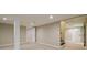 Spacious basement with access to stairs, multiple entryways, recessed lights, and neutral-toned walls at 5170 2Nd St, Morrow, GA 30260