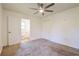 Bright bedroom with a ceiling fan and a door leading to the bathroom at 5170 2Nd St, Morrow, GA 30260