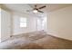 Spacious bedroom with neutral carpet and a ceiling fan at 5170 2Nd St, Morrow, GA 30260