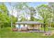 Charming single story home with a front porch and convenient covered parking area at 5170 2Nd St, Morrow, GA 30260