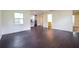 Open living room showing view to the kitchen and entry to bathroom and bedrooms at 5170 2Nd St, Morrow, GA 30260