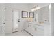 Bathroom featuring marble counters, shiplap walls, and modern gold hardware at 9315 Prestwick Club Dr, Johns Creek, GA 30097