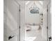 Luxury bathroom featuring a soaking tub under an arch window with white shiplap walls at 9315 Prestwick Club Dr, Johns Creek, GA 30097