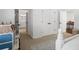 Bedroom showcases beautiful doors and a dollhouse at 9315 Prestwick Club Dr, Johns Creek, GA 30097