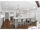 Bright, open kitchen with a large island, stainless steel appliances, and modern lighting at 9315 Prestwick Club Dr, Johns Creek, GA 30097