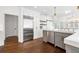 Modern kitchen featuring stainless steel appliances, custom cabinetry, and a marble countertop island at 9315 Prestwick Club Dr, Johns Creek, GA 30097