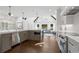 Gourmet kitchen featuring stainless steel appliances, stone countertops, and an open layout at 9315 Prestwick Club Dr, Johns Creek, GA 30097