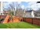 Fenced backyard with healthy lawn is ready for entertaining and play at 1093 Third St, Stone Mountain, GA 30083