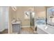 Stylish bathroom featuring glass shower, soaking tub, granite counters, and modern fixtures at 1093 Third St, Stone Mountain, GA 30083
