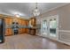 Well-lit kitchen featuring stainless steel appliances, granite countertops, and french doors leading to outdoor deck at 1093 Third St, Stone Mountain, GA 30083