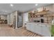 Stylish kitchenette with white cabinets, shelving, stainless steel appliances, and a decorative rug at 1093 Third St, Stone Mountain, GA 30083