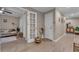 Open living area with wood-look floors, stylish furniture, and access to other rooms, creating a welcoming space at 1093 Third St, Stone Mountain, GA 30083