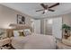 Main bedroom featuring a plush bed, ceiling fan, carpet, and closet access at 1093 Third St, Stone Mountain, GA 30083