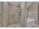 Elegant bathroom features a walk-in glass shower with designer tile and built-in shelving at 1093 Third St, Stone Mountain, GA 30083