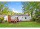 The private backyard features a deck, stairs and a grassy area at 269 Moreland Way, Atlanta, GA 30354