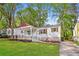 Charming bungalow with a covered front porch, green lawn, and inviting curb appeal at 269 Moreland Way, Atlanta, GA 30354