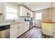 Modern kitchen with stainless steel appliances, marble countertops and white cabinets at 269 Moreland Way, Atlanta, GA 30354
