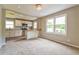Open concept living area connecting to a modern kitchen with stainless steel appliances at 269 Moreland Way, Atlanta, GA 30354