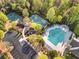 A gorgeous aerial view of the community pool, playground, basketball courts, and parking areas at 3120 Abbey Sw Dr, Atlanta, GA 30331