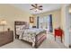 Cozy bedroom with a queen bed, bedside table, and window with blinds at 3120 Abbey Sw Dr, Atlanta, GA 30331