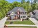 Beautiful two-story brick home featuring a landscaped front yard, charming porch, and attached garage at 3120 Abbey Sw Dr, Atlanta, GA 30331